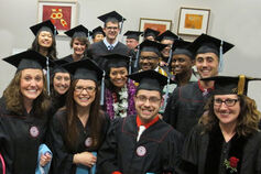 A group shot of smiling graduates from the School of Education.